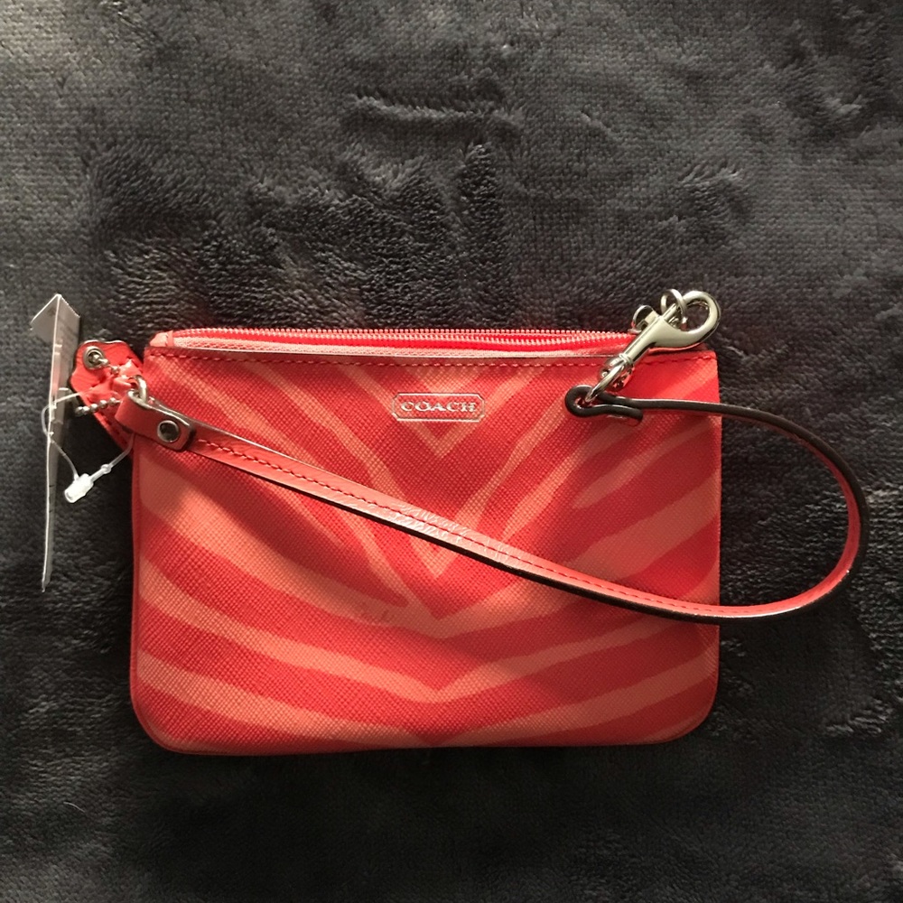 Small brand new Coach leather wristlet.
